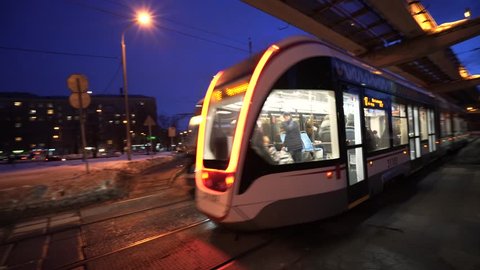 Tram in the sunset in Moscow. Ostankinskay TV tower on the background