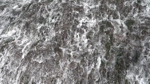 Waterfall at slow motion in the stone monastery