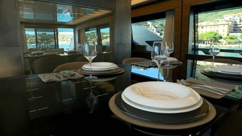 Elegant table set for lunch on a luxury yacht.
