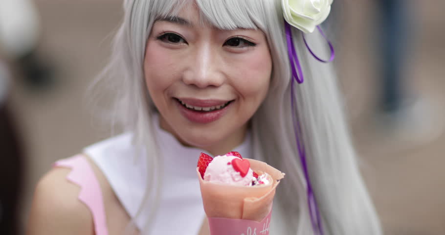 Japanese female eating in Harajuku, Tokyo, Japan Royalty-Free Stock Footage #1009091498