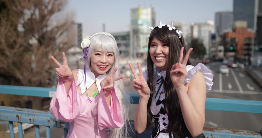 Portrait of two Japanese female friends looking to camera, Harajuku, Tokyo, Japan Royalty-Free Stock Footage #1009091564