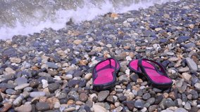pink flip flops on the beach