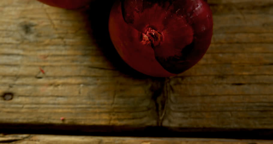 Close-up of onions on a wooden table 4k