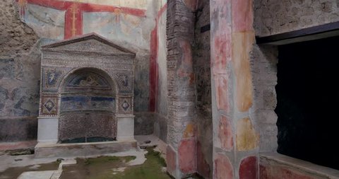 Interior of the house in Pompei. Old wall paintings in Archeological Park near Naples.