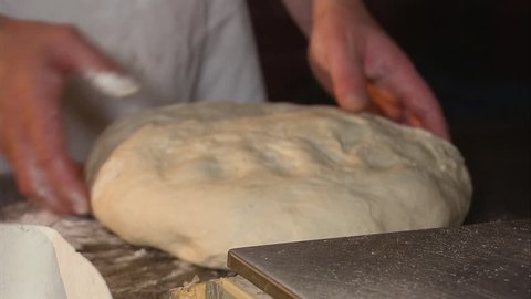 A steady close up shot of a kneaded dough.
