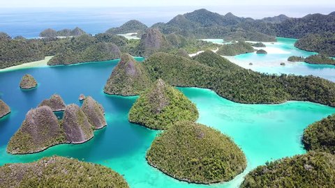 Beautiful limestone islands are found in the idyllic, tropical lagoon of Wayag, Raja Ampat, Indonesia. This unique, equatorial region is best known for its vast array of marine biodiversity.