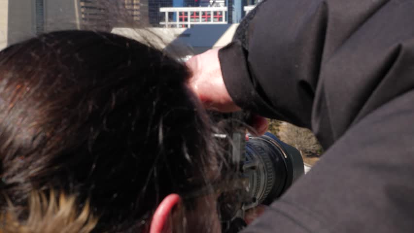 Photographer on top of roof taking photos of downtown 6