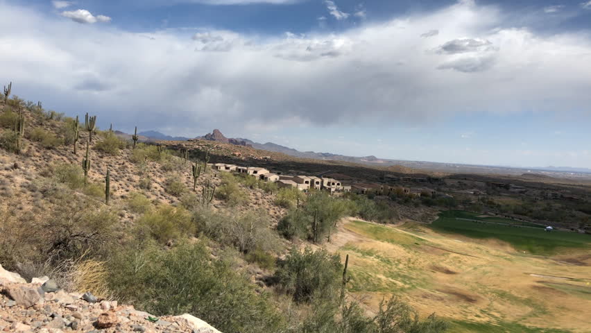 Fountain Hills time lapse overlooking desert landscape,residential areas and golf course.