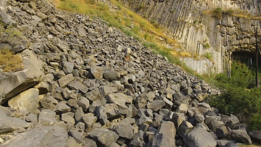 Rock slides and stones scattered over hills, risk of mudflow, geology science