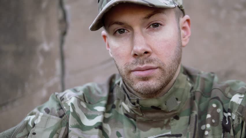 Portrait Of Sad, Tired Young Army Soldier Facing Reality Of Duty. Part Of A 4K Collection With A Variety Of Stories And Camera Angles. The Same Actor Also Back Home With Nightmare, Insomnia PTSD.