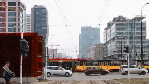 Warsaw roundabout in the center of the city 20. March. 2018. Business center of the city of Warsaw, Cars and trams stand at the traffic lights. City street traffic lights at road intersection.