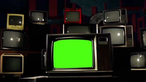 Retro TV with Green Screen and Many Vintage TVs. Dolly Shot. Contrasted Tone. You can Replace Green Screen with the Footage or Picture you Want with “Keying” effect in AE (check out tutorials on YT).