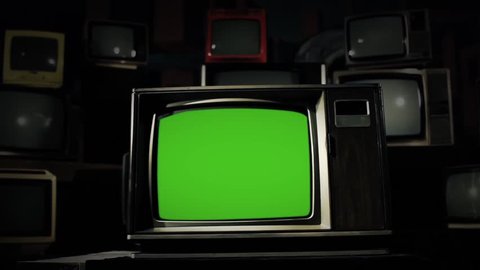 80s TV with Green Screen in the Middle of Many Old TVs. Steel Tone. Dolly. You can Replace Green Screen with the Footage or Picture you Want with “Keying” effect in AE (check out tutorials on YT).
