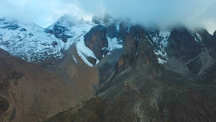 aerial footage of Mount Kenya peaks in clouds