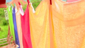 Drying towels on the clothesline. Clean laundry hanging on a clothesline