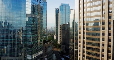 JAKARTA - Indonesia. March 19, 2018: Aerial landscape of modern skyscrapers with glass windows in Jakarta central business district from a drone. Shot in 4k resolution