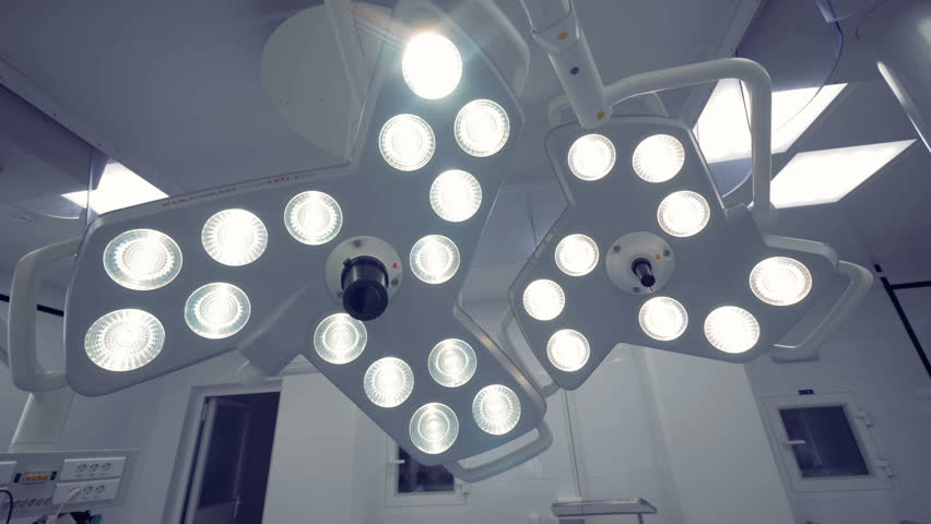 Two surgical lamps located in an operating theatre. Coronavirus, COVID-19, 2019-nCoV concept.
 Royalty-Free Stock Footage #1009181726