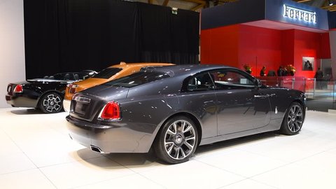 BRUSSELS, BELGIUM - JANUARY 10, 2018: Rolls-Royce Wraith luxury coupe, Rolls Royce Phantom (Rolls-Royce Phantom VIII) and Black Badge Dawn exclusive cars on display at the 2018 European motor show in 