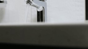 water faucet in a luxurious hotel room or at home in the bathroom. Dolly video