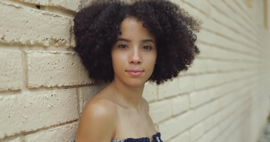 Black preteen girls nude Headshot Of Young African American Girl With Nude Shoulders And Short Rich Curls Looking At Camera Leaning On Wall