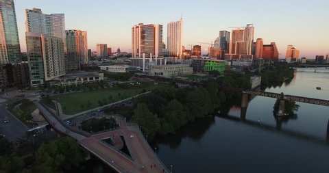Austin Texas at sunset over the river facing downtown Stock Video