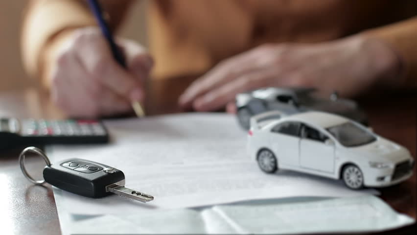 Male hands signing car insurance contract. concept: car insurance, car sales, garages, rental and alarm systems | Shutterstock HD Video #1009211363