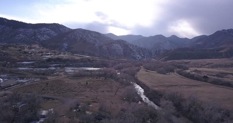 A pan of Waterton Canyon located adjacent to Roxborough park, Littleton CO. Snow still peppers the majestic mountains surrounding the canyon วิดีโอสต็อก