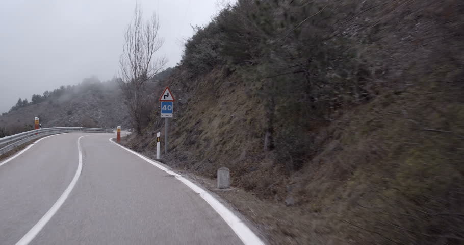 subjective image of driving on a mountain curved road in Madrid, Spain. Filmed on March 29, 2018.