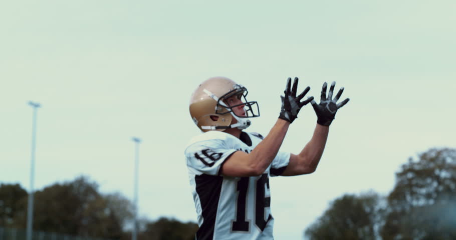 Slow motion American football players in stadium 4K shot on Phantom Flex
