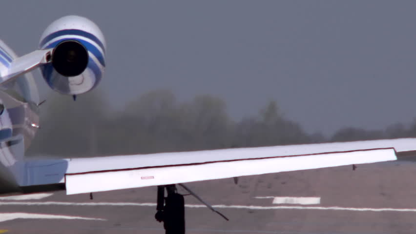 Executive jet Taking off from behind at Oxford Airport. This airfield is used extensively for business and private avaiation.