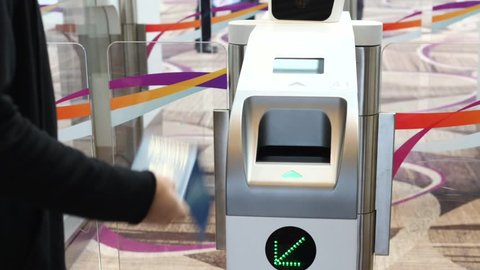 Immigration Automated Clearance System. Woman Scan Passport At Self-Check-In Customs.