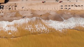 Aerial view of clay-polluted sea coast. Muddy sea water. Environmental contamination. Chemical accident. Video shot with a drone.