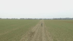 Little boy riding a bike.	
Boy riding a bike along the cycle path. Aerial view. Stabilized video.