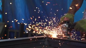 Worker grinding metal, metal grinding machine with sparks, metal sawing. Super slow motion 200 fps - Powered by Shutterstock - Get 15% off with code: PIKWIZARD15