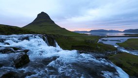 Beautiful footage of the Kirkjufellsfoss waterfall. Location Kirkjufell mountains, Iceland, Europe. Amazing view of most popularly photographed areas. Discover the beauty of earth. Full HD 1080p video