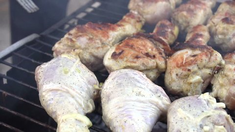 Roasted chicken thighs at barbecue - close up 