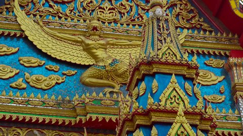 Steadycam shot of a buddhist temple Wat Putta Mongkon, Wat Mongkol Nimit, in Phuket town, Phuket island, Thailand