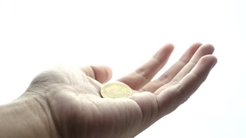 Man hand begging on a white background with coin falling into hand in slow motion. Concepts and ideas