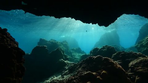 underwater caves and tunnels with nice lightning  sun rays and sun beams relaxing ocean scenery backgrounds