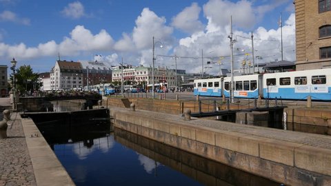A tram passes the old canal in Gothenburg. The canal in Gothenburg flows through the centre of the city. Central station is the starting point for most tram routes.