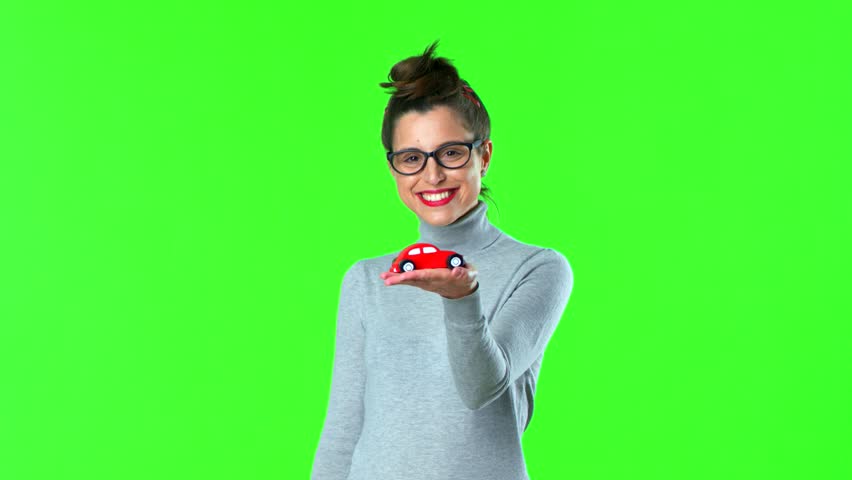 young pretty woman with a red car toy