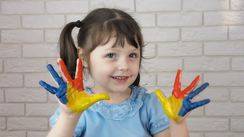 Little artist. Paint on the hands of the child
