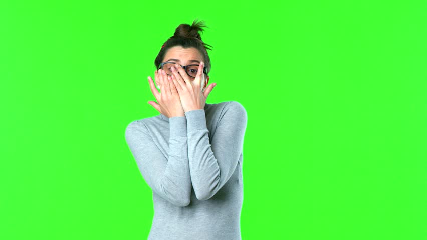 young pretty woman covering her face