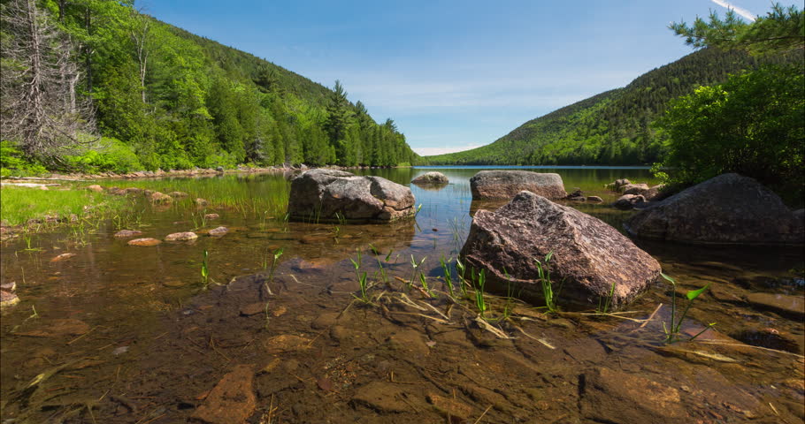 A motion controlled time lapse of a sunny summer day at Bubble Pond in Acadia National Park, Maine.
