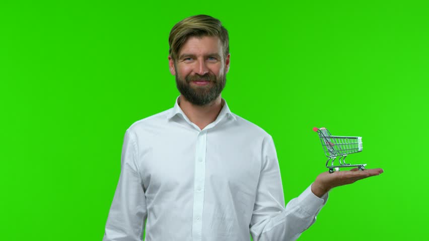 blonde handsome man with a shopping cart prop