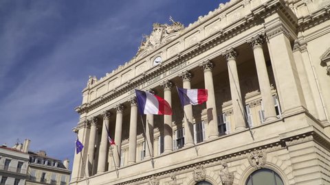 Blowing french flags at Chamber of Commerce in Marseille Stock Video