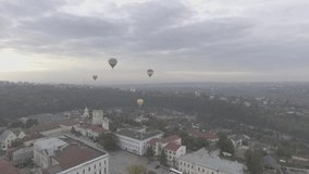 video footage with balloons that rises with tourist to have a nice view over the city.
