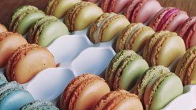Ranging fresh macaroons ready for sale. HD video.