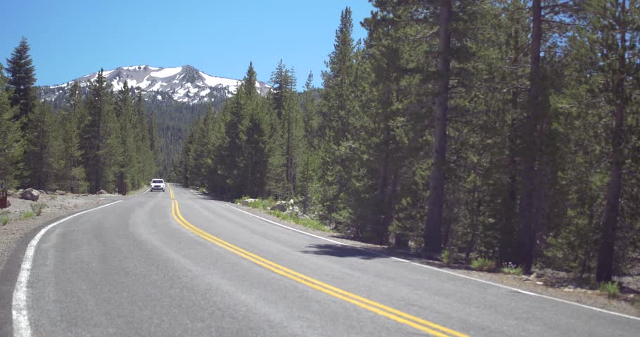 LASSEN VOLCANIC NATIONAL PARK - July 16: Car Driving on Scenic Highway before Lassen Peak on July 16 2016 in Lassen Volcanic National Park, California