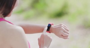 woman use wearable smart watch in the forest